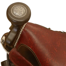 Load image into Gallery viewer, The Bronco Saddle Barstool features a handcrafted full-grain leather saddle seat with cowhide fenders, hand-forged iron medallion, and wood pedestal base. A 180° swivel Western barstool blending authentic cowboy craftsmanship with rustic luxury.