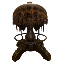Load image into Gallery viewer, The Bronco Saddle Barstool features a handcrafted full-grain leather saddle seat with cowhide fenders, hand-forged iron medallion, and wood pedestal base. A 180° swivel Western barstool blending authentic cowboy craftsmanship with rustic luxury.