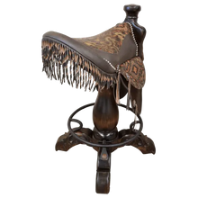 Load image into Gallery viewer, The Chaps Saddle Barstool features full-grain leather, embossed Western patterns, copper conchos, and a 180° swivel wooden base. A handcrafted Western saddle barstool that celebrates cowboy craftsmanship and the artistry of the American frontier.