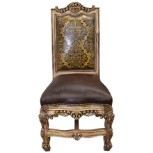 Load image into Gallery viewer, The Picador Dining Chair features full-grain leather upholstery, embossed floral detailing, and hand-carved hardwood. A Spanish Colonial-inspired dining chair blending Western luxury with artisanal craftsmanship. 100% customizable and guaranteed for life.