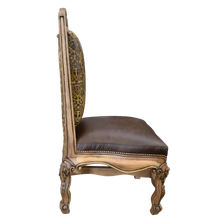 Load image into Gallery viewer, The Picador Dining Chair features full-grain leather upholstery, embossed floral detailing, and hand-carved hardwood. A Spanish Colonial-inspired dining chair blending Western luxury with artisanal craftsmanship. 100% customizable and guaranteed for life.