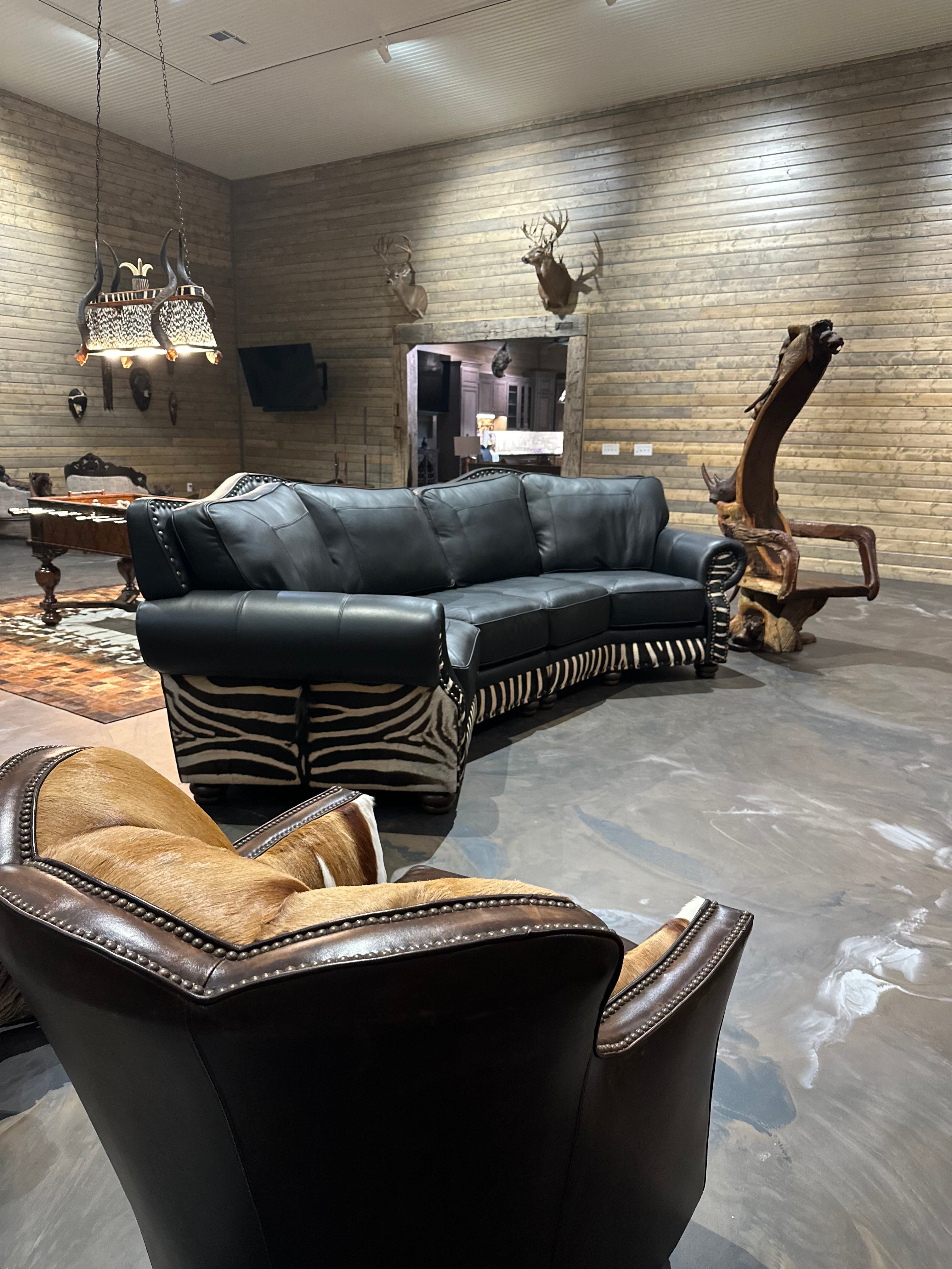 An arrangement of western leather and hide furniture custom designed for clients.