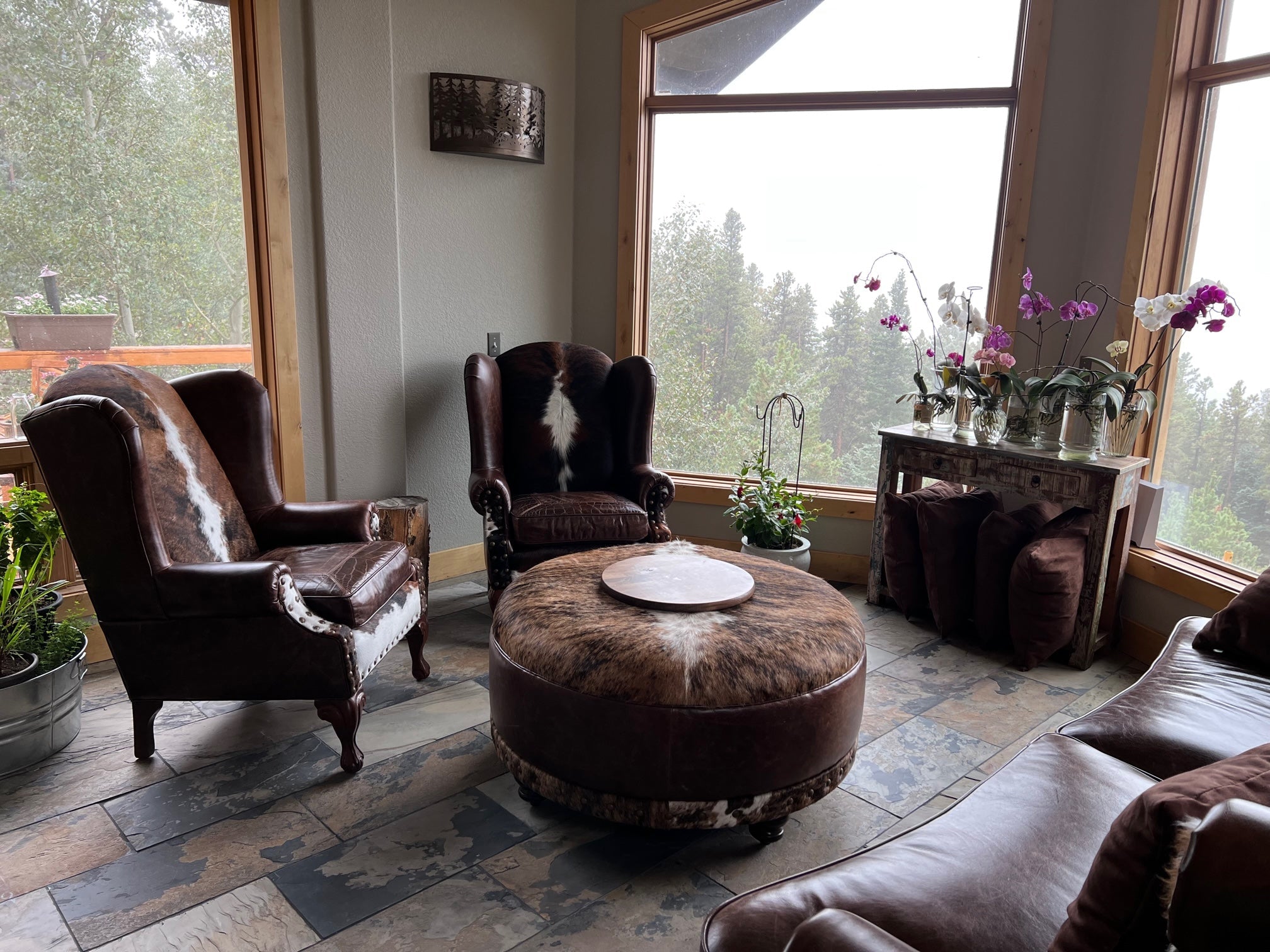 An arrangement of western leather and hide furniture custom designed for clients.