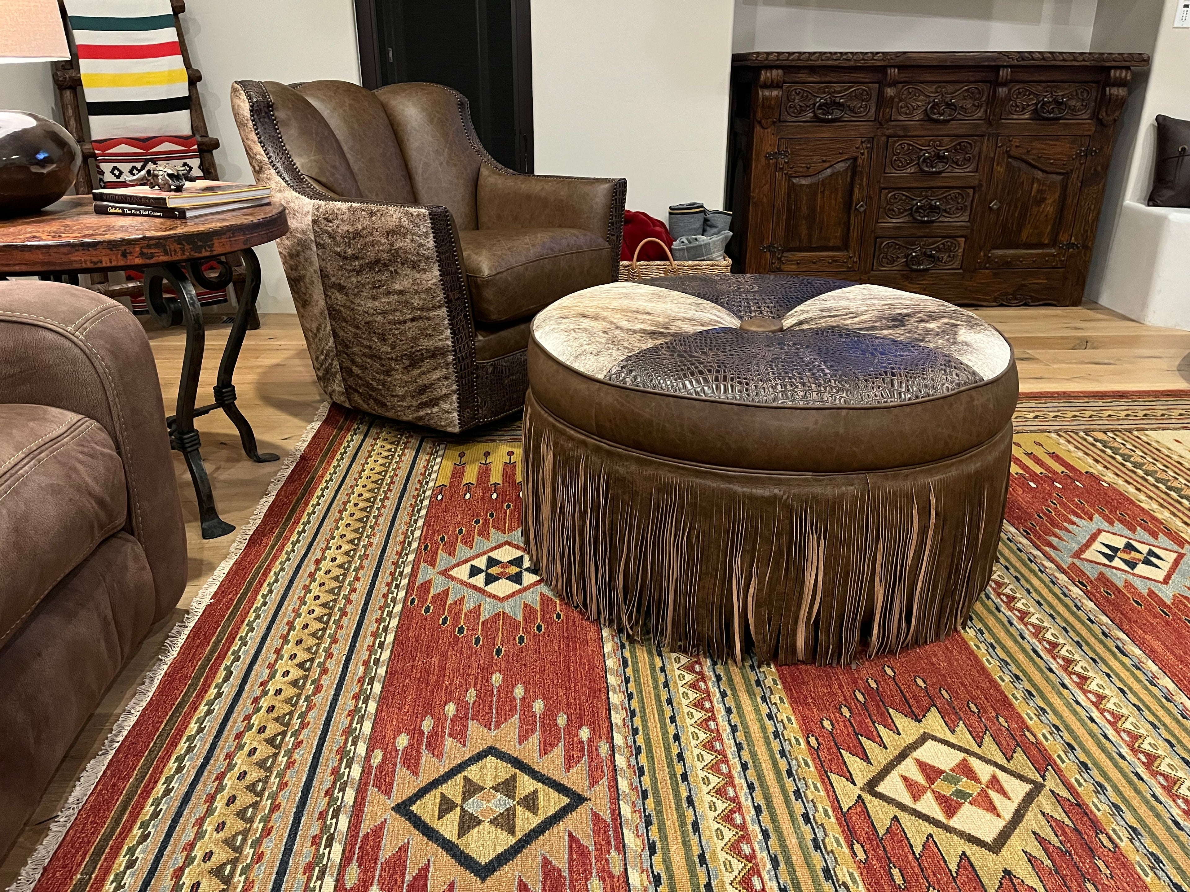 An arrangement of western leather and hide furniture custom designed for clients.