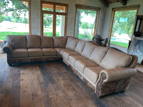 An arrangement of western leather and hide furniture custom designed for clients.