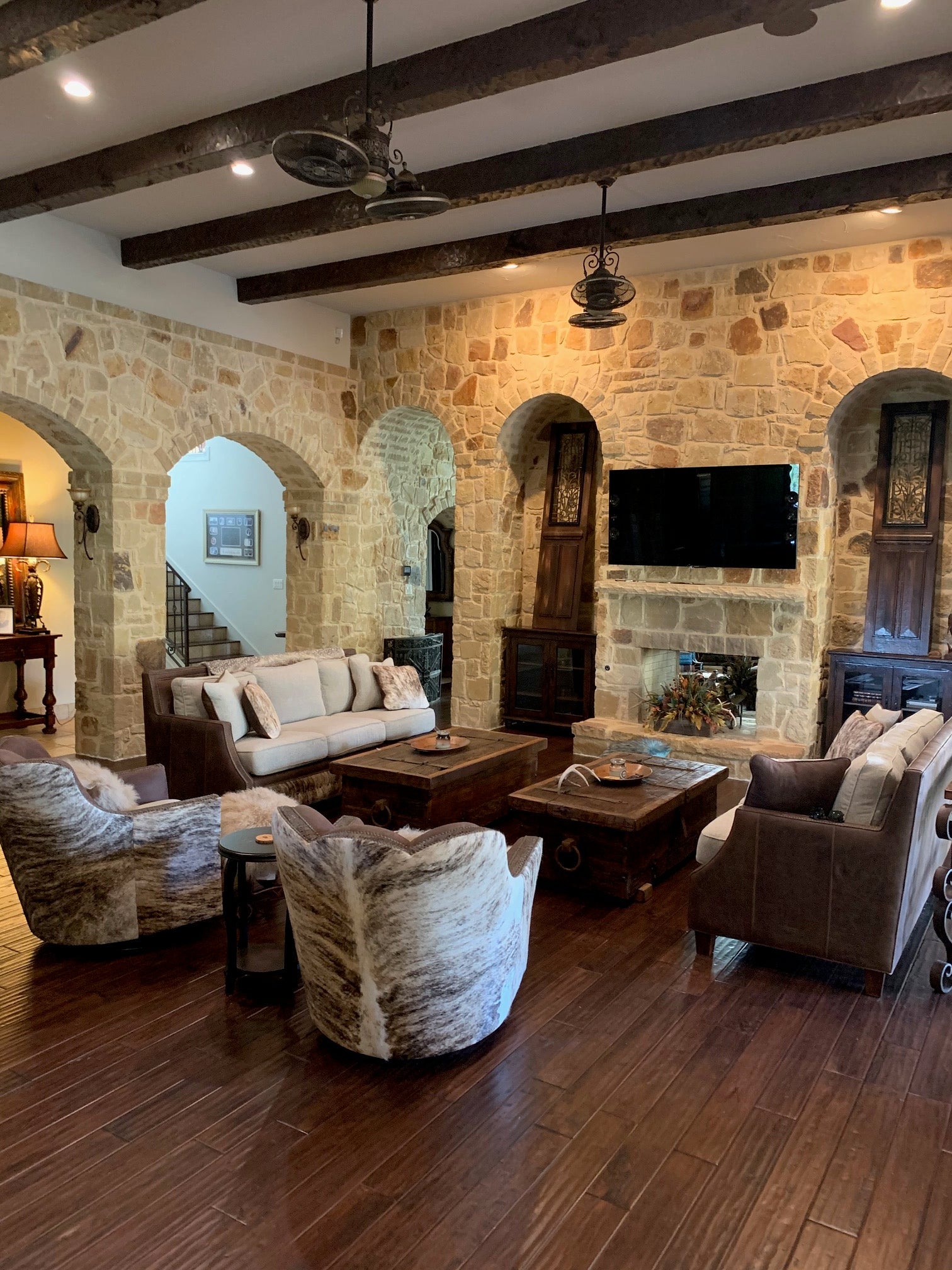 An arrangement of western leather and hide furniture custom designed for clients.