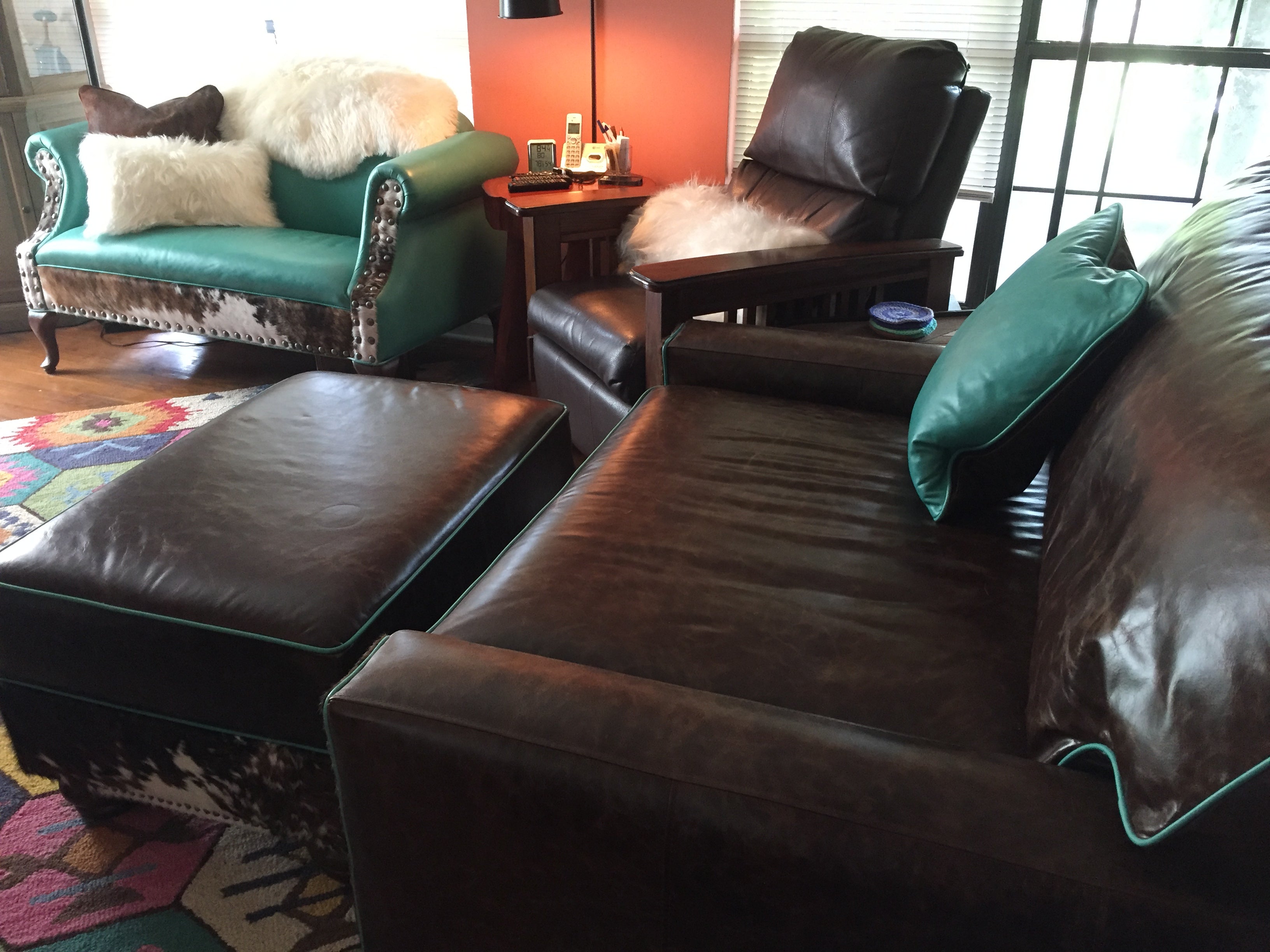 An arrangement of western leather and hide furniture custom designed for clients.