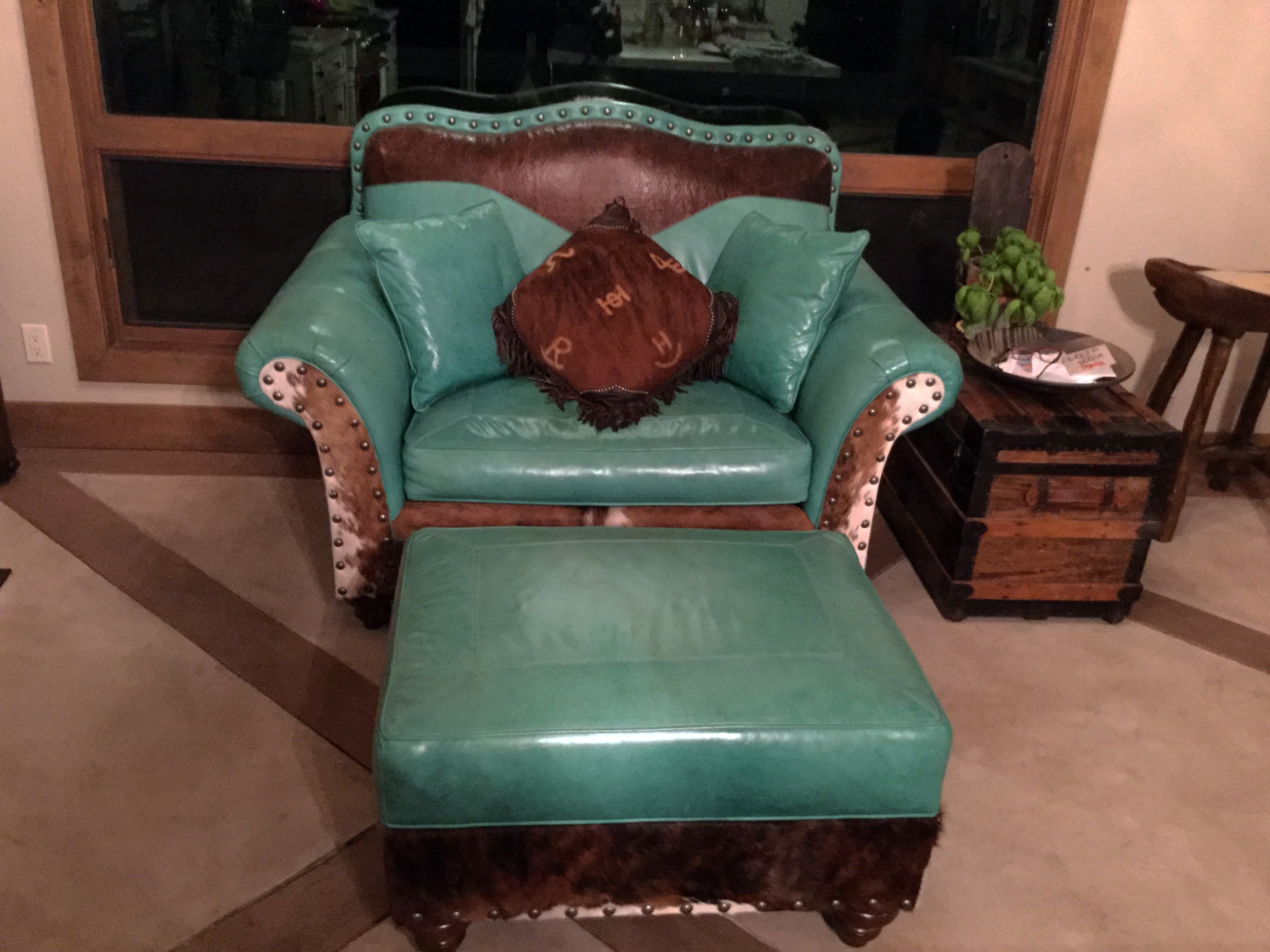 An arrangement of western leather and hide furniture custom designed for clients.