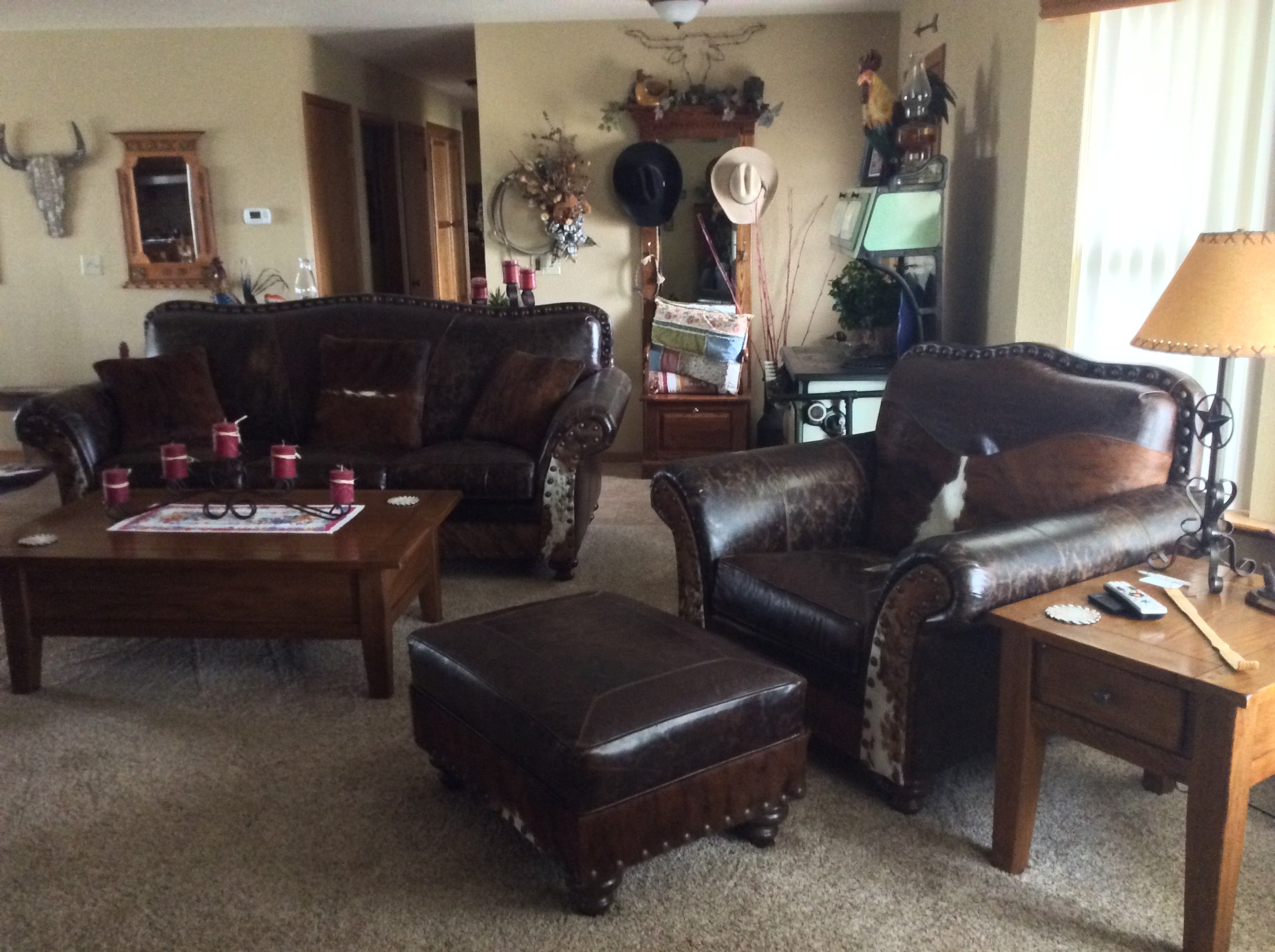 An arrangement of western leather and hide furniture custom designed for clients.