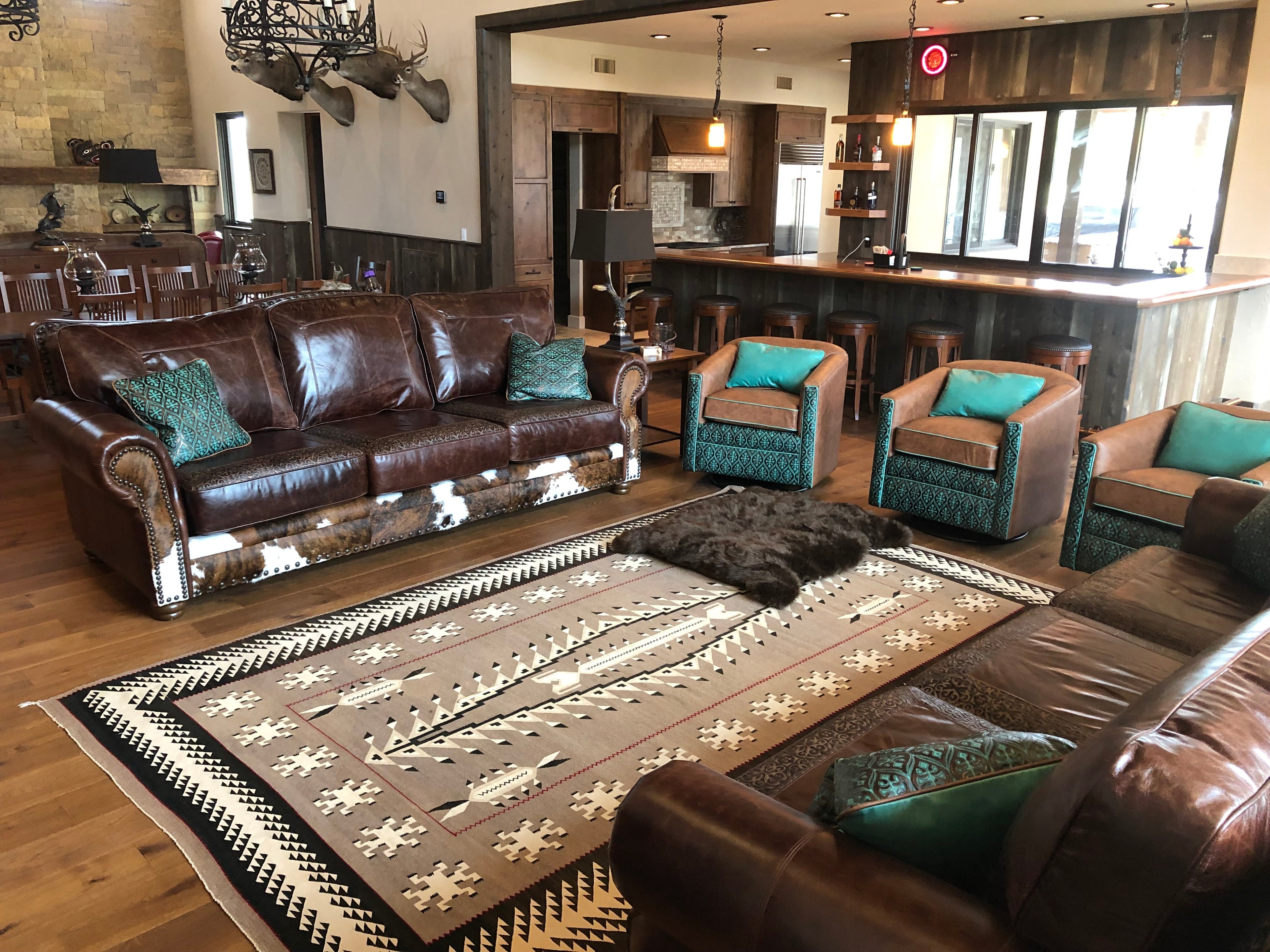 An arrangement of western leather and hide furniture custom designed for clients.