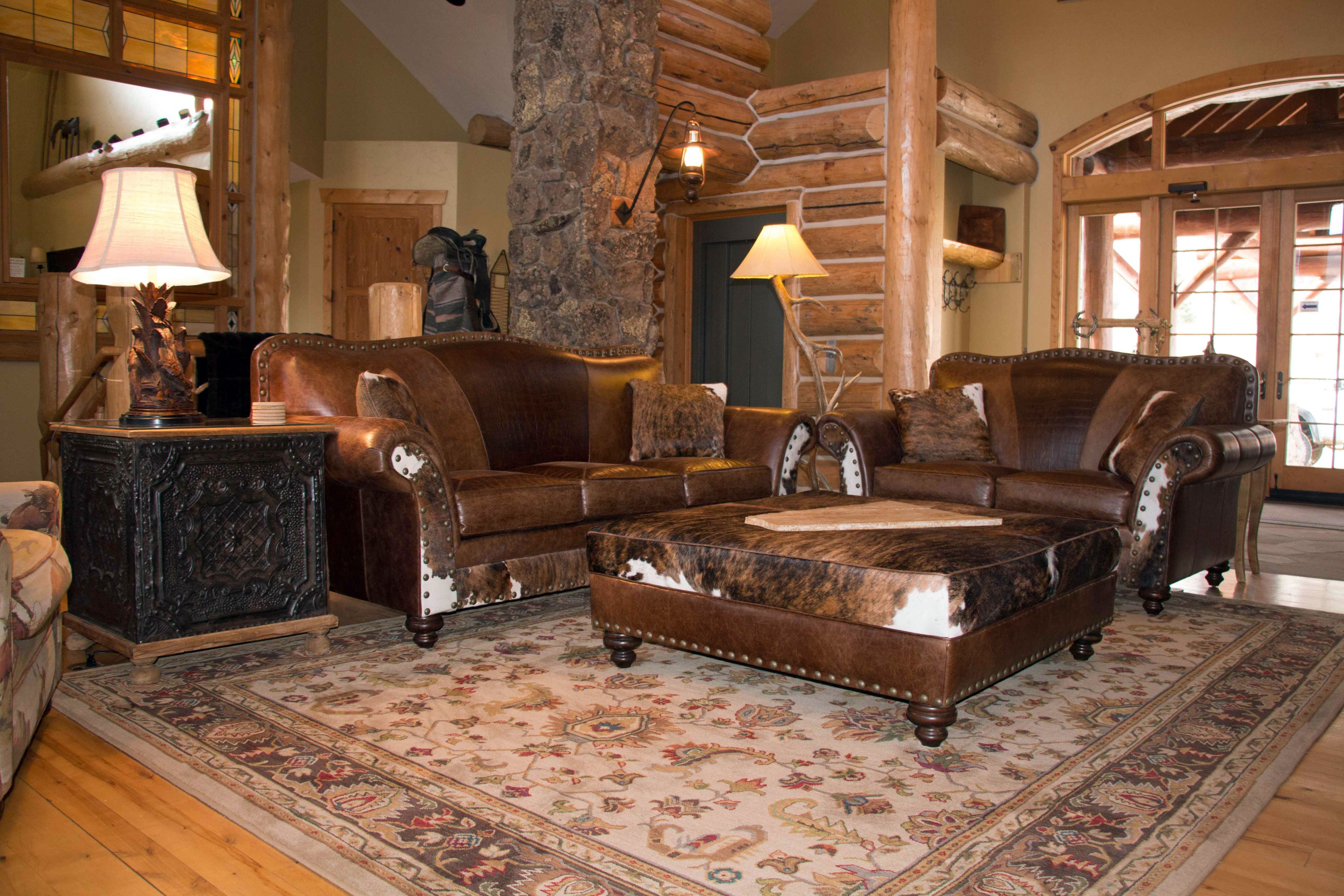 An arrangement of western leather and hide furniture custom designed for clients.