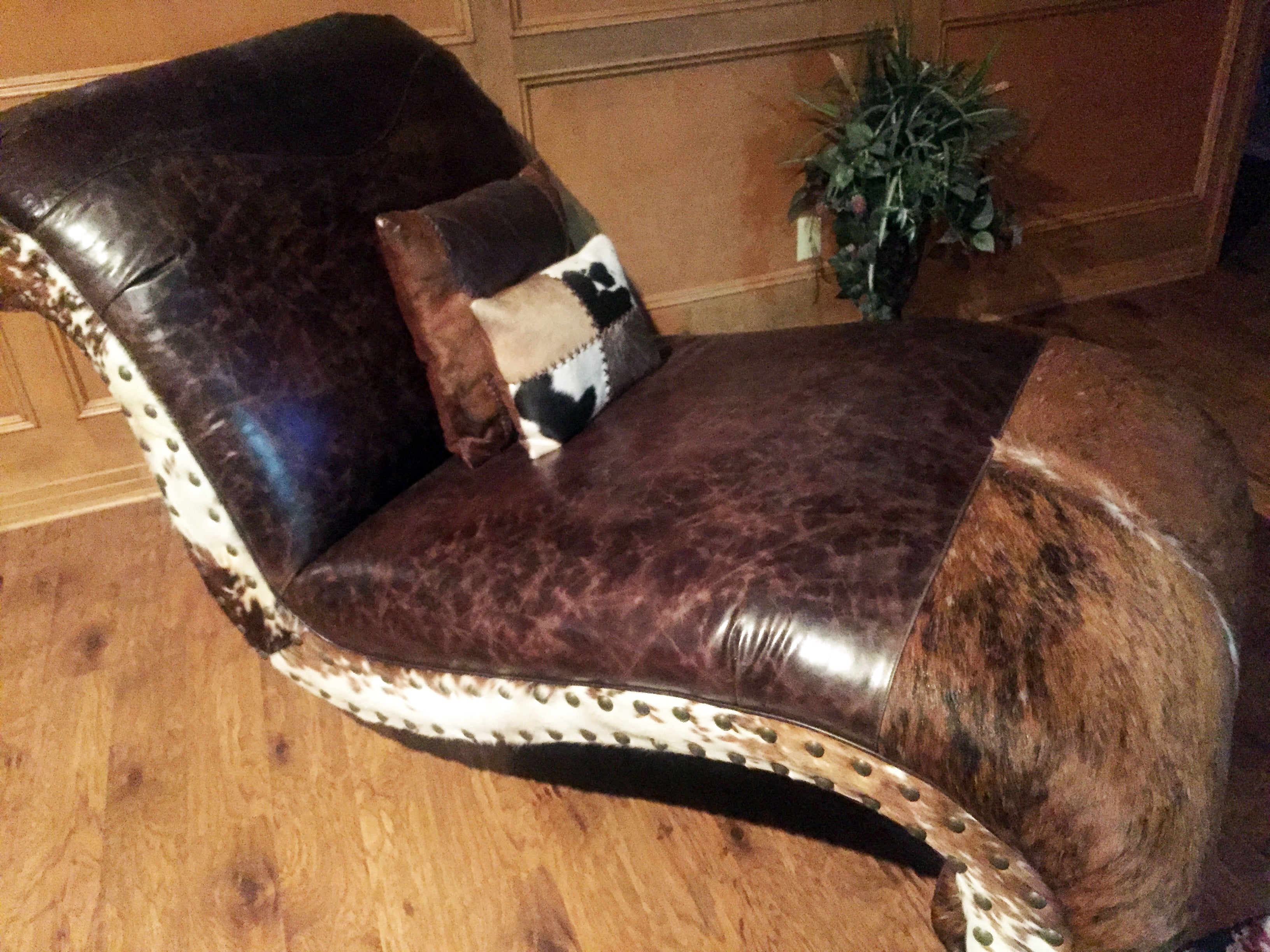 An arrangement of western leather and hide furniture custom designed for clients.