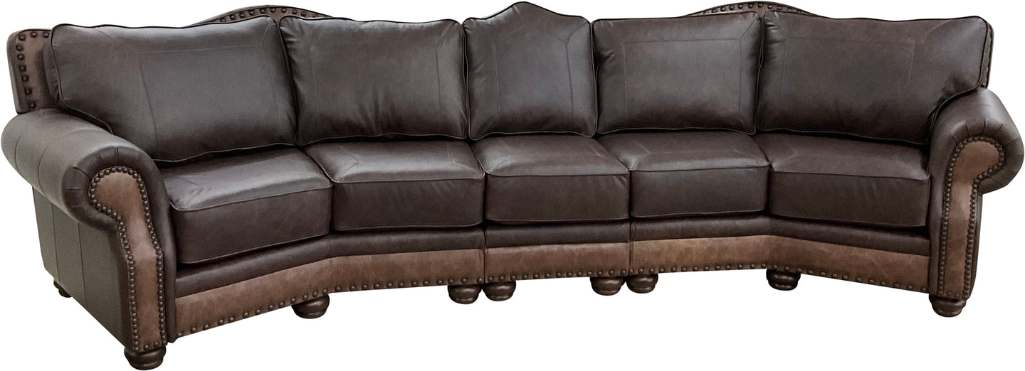 Upgrade your living space with The Houstonian Large Curved Sectional Sofa, crafted in Palio Dark Brown leather with Palio Café accents. A bold, elegant design with plush comfort and timeless Western-inspired detailing.