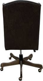 The Boardroom Desk Chair features Palio Texas full-grain leather, hand-tacked trim, and a solid wood base with brass casters. Handcrafted for comfort, durability, and executive Western elegance — fully customizable to your style.