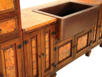Upgrade your kitchen with a handcrafted copper sink and rustic storage cabinets. Featuring hammered copper, wood cabinetry, and iron details, this design combines beauty and function.