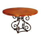 Round wooden table with decorative metal base on a white background