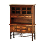 Wooden buffet cabinet with glass doors and metal accents on a white background