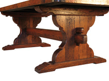 Load image into Gallery viewer, Discover the Trestle Copper Dining Table, featuring a handcrafted wood trestle base and a hammered copper top. Available in multiple sizes with custom options for a perfect fit.