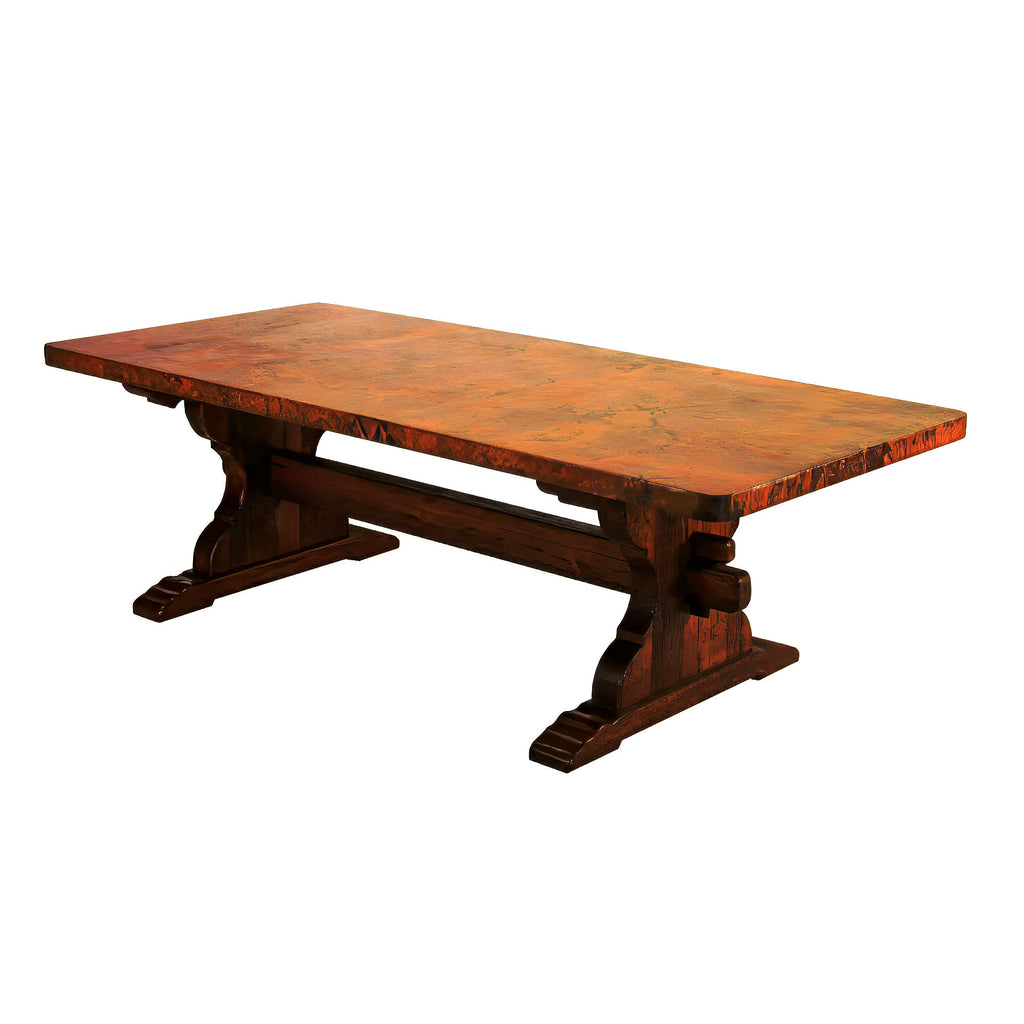 Discover the Trestle Copper Dining Table, featuring a handcrafted wood trestle base and a hammered copper top. Available in multiple sizes with custom options for a perfect fit.