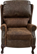 Load image into Gallery viewer, The Sandpoint Recliner combines Cora Pecan leather, Floral Bone Black embossed accents, and Hair-on-Hide Dark Exotic cowhide. A handcrafted Western-style recliner with classic wingback design, double bustleback cushions, and classic nailhead trim.