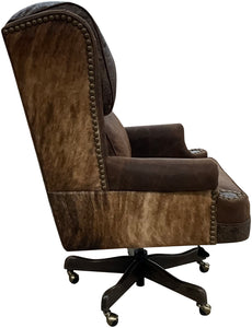 The President’s Executive Chair combines Cora Pecan leather, Floral Bone Black accents, and Hair-on-Hide Dark Exotic cowhide. A handcrafted Western wingback chair designed for power, prestige, and comfort.