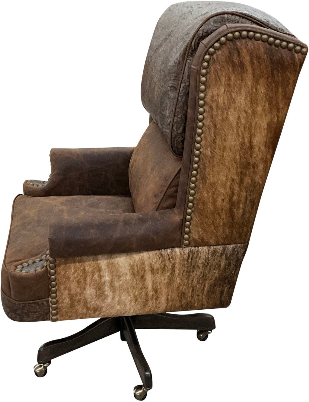 The President’s Executive Chair combines Cora Pecan leather, Floral Bone Black accents, and Hair-on-Hide Dark Exotic cowhide. A handcrafted Western wingback chair designed for power, prestige, and comfort.