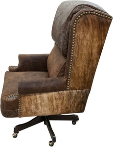 The President’s Executive Chair combines Cora Pecan leather, Floral Bone Black accents, and Hair-on-Hide Dark Exotic cowhide. A handcrafted Western wingback chair designed for power, prestige, and comfort.