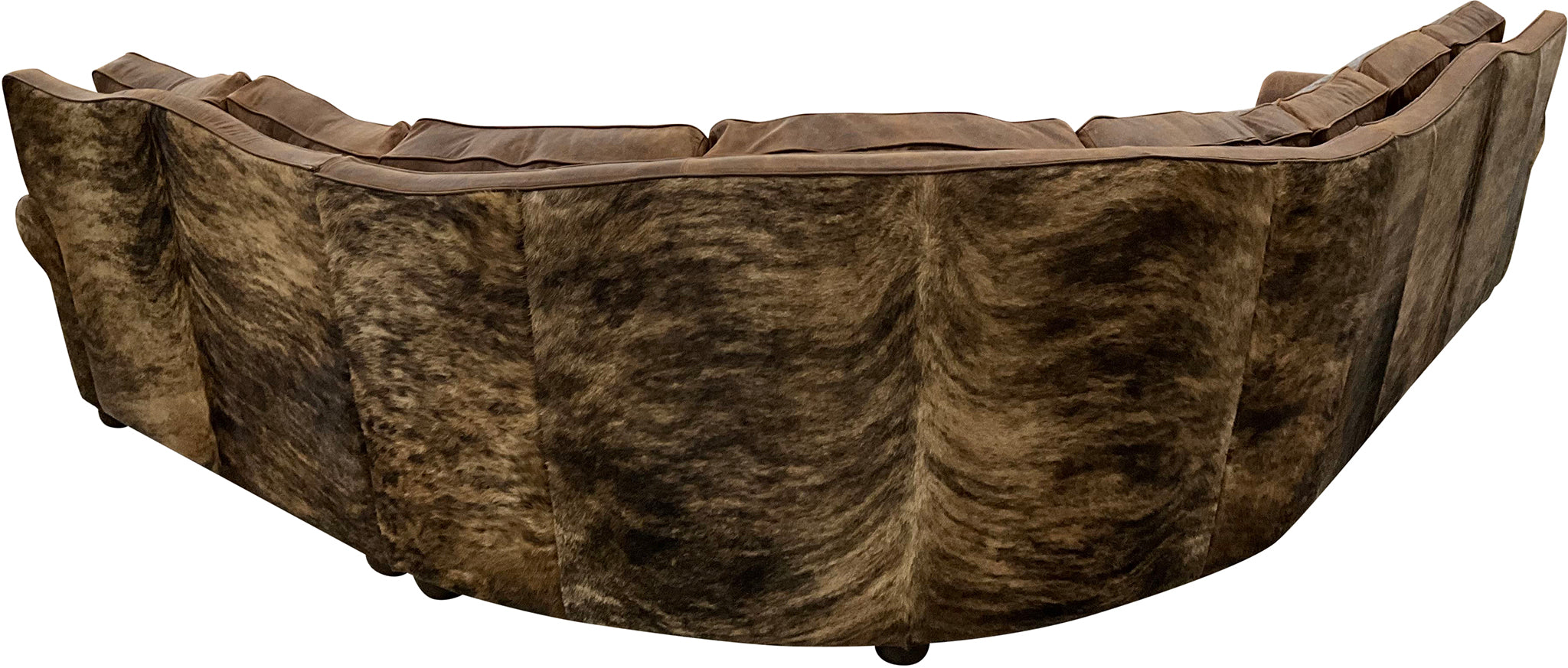 The Sandpoint Sectional features Cora Pecan leather, Floral Bone Black accents, and Hair-on-Hide Dark Exotic cowhide. With a large three-cushion pie piece and three-point yoke back cushions, this Western sectional offers luxury, comfort, and bold style.