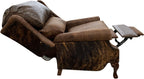 The Sandpoint Recliner combines Cora Pecan leather, Floral Bone Black embossed accents, and Hair-on-Hide Dark Exotic cowhide. A handcrafted Western-style recliner with classic wingback design, double bustleback cushions, and classic nailhead trim.
