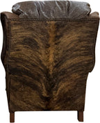 The Sandpoint Recliner combines Cora Pecan leather, Floral Bone Black embossed accents, and Hair-on-Hide Dark Exotic cowhide. A handcrafted Western-style recliner with classic wingback design, double bustleback cushions, and classic nailhead trim.