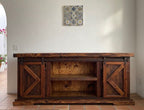 The Old World Buffet Cabinet is made using new and reclaimed pine wood.&nbsp; It has two barn doors to an open shelf, two drawers and two cabinet doors.&nbsp; Each with iron hardware.&nbsp; Cabinet handles are hand made in house. Single shelf inside the two barn doors.