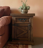 The Old World Bedside Or End Table cabinet is made using new and reclaimed pine wood.&nbsp; It has one door and one drawer.&nbsp; Each with modern hardware that are curved hammered flat iron handles.&nbsp; Handles are hand made in house.