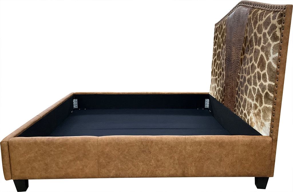 The Serengeti Bed features authentic Giraffe hide, Gator Rustic Cognac leather, and a Landman Saddle leather base. A handcrafted Western bed that blends exotic luxury with bold, natural elegance — made to be unforgettable.
