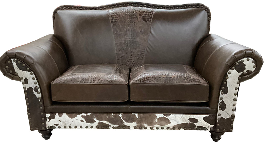 Western leather loveseat with Galveston Vintage leather, Rustic Walnut gator-embossed accents, and black & white salt-and-pepper cowhide panels. Luxury ranch loveseat.