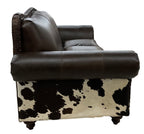 Western leather loveseat with Galveston Vintage leather, Rustic Walnut gator-embossed accents, and black & white salt-and-pepper cowhide panels. Luxury ranch loveseat.