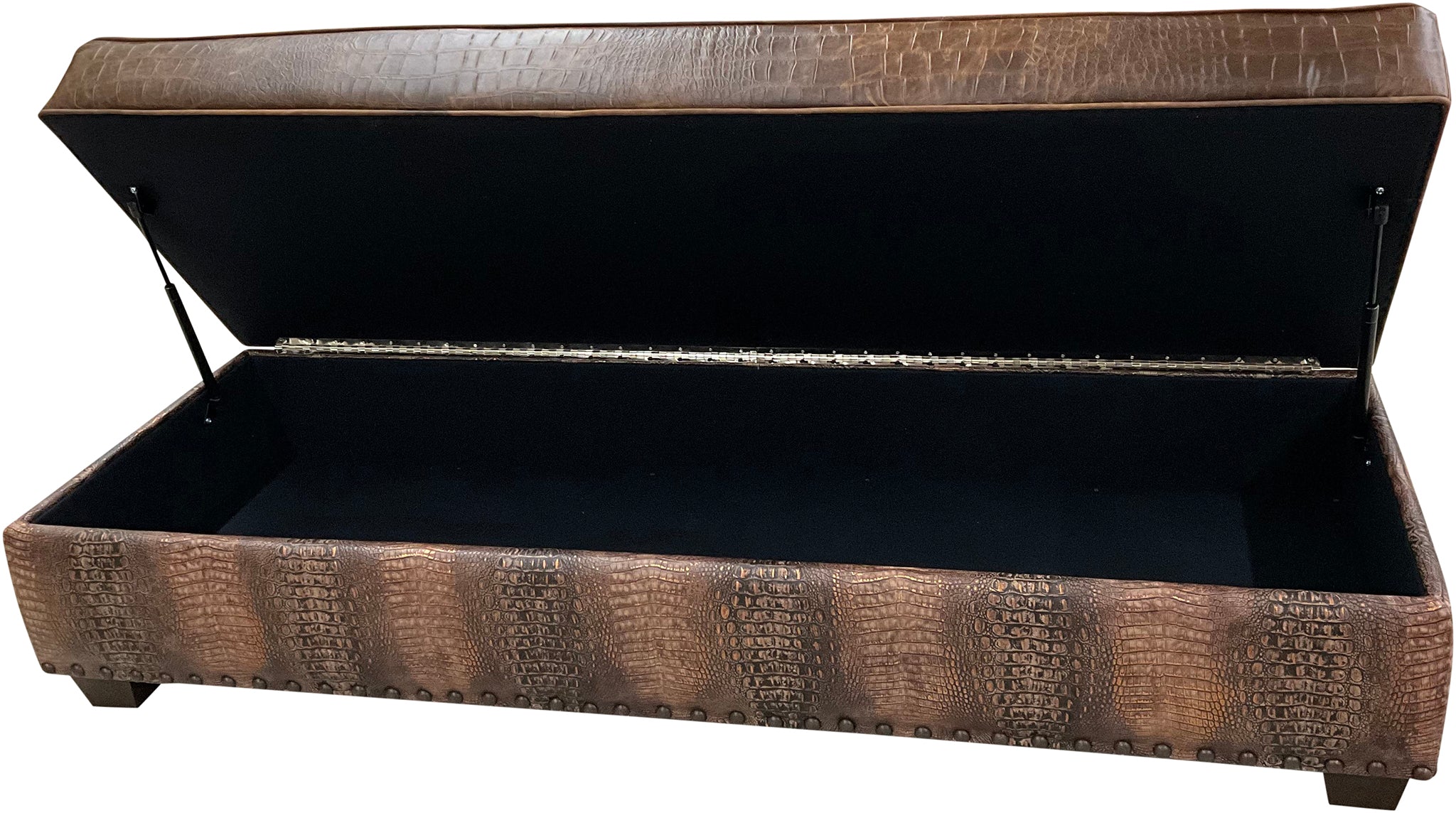 A rectangular storage ottoman with a brown distressed top grain Cora Pecan leather upholstery, featuring Croc Brompton borders and a copper brown accent around the rail.