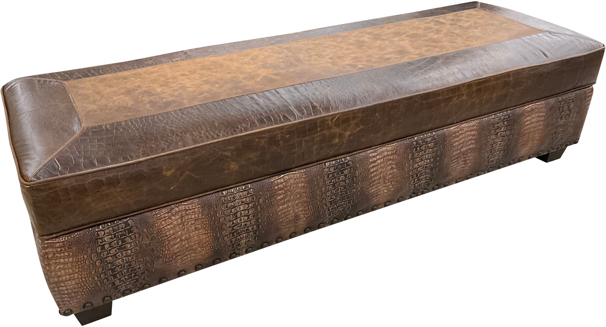 A rectangular storage ottoman with a brown distressed top grain Cora Pecan leather upholstery, featuring Croc Brompton borders and a copper brown accent around the rail.
