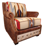 A Western Trails chair with brown Cora Pecan leather upholstery and Rustic Walnut Gator accents, featuring Wyeth Trail Pendleton-style fabric on the seat and back cushions, placed in a room with wooden walls.