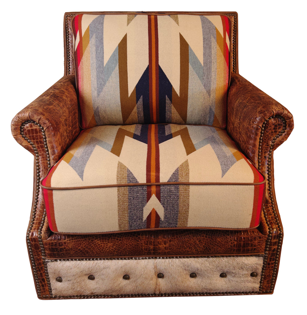 A Western Trails chair with brown Cora Pecan leather upholstery and Rustic Walnut Gator accents, featuring Wyeth Trail Pendleton-style fabric on the seat and back cushions, placed in a room with wooden walls.