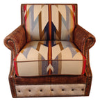 A Western Trails chair with brown Cora Pecan leather upholstery and Rustic Walnut Gator accents, featuring Wyeth Trail Pendleton-style fabric on the seat and back cushions, placed in a room with wooden walls.