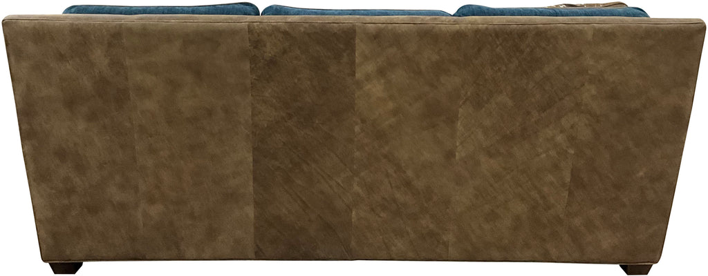 Luxury Western sofa with Stallone Branch leather frame, Devotion Denim fabric cushions, and Axis hide accents. Nailhead trim designer ranch and lodge sofa.