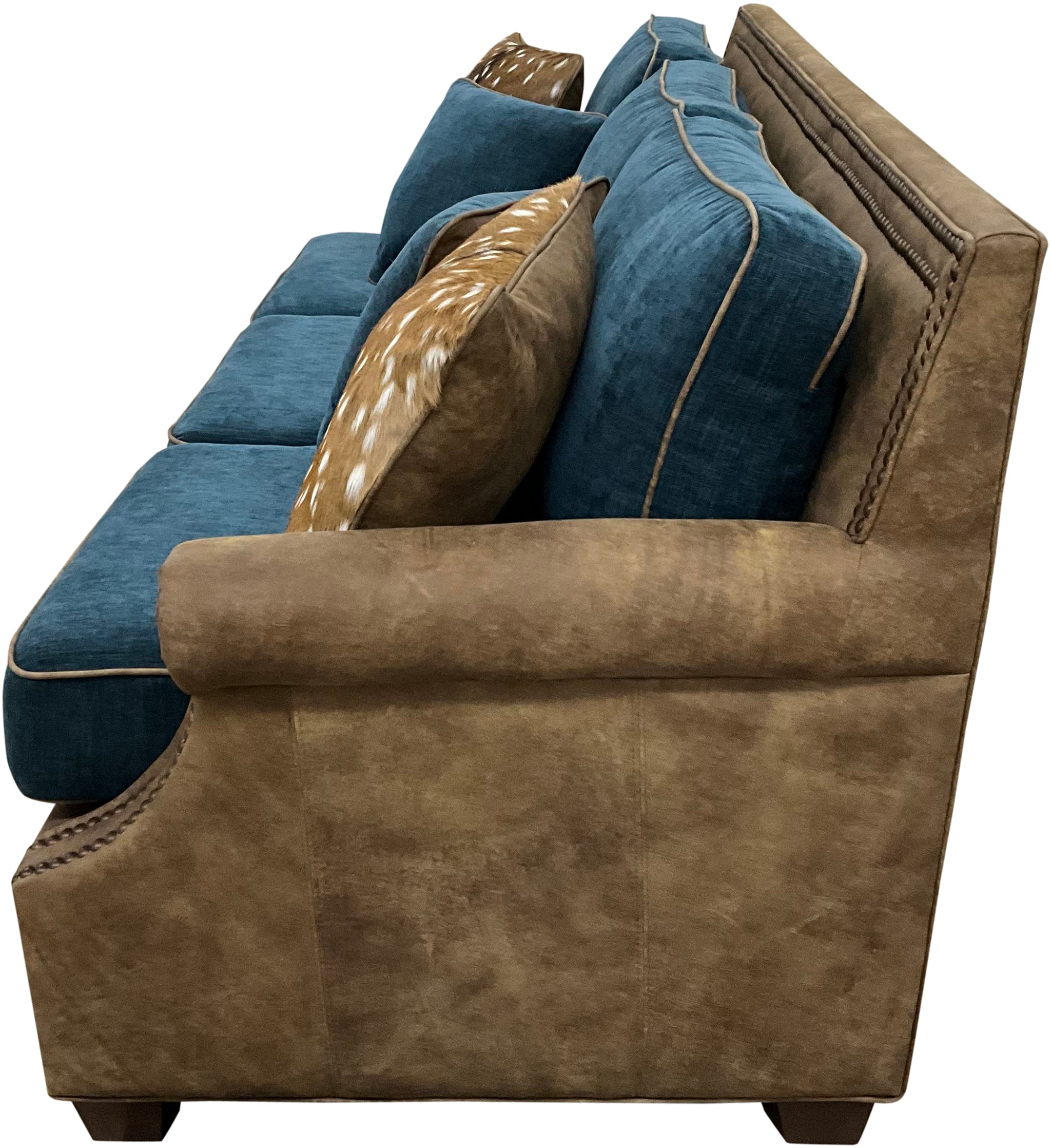 Luxury Western sofa with Stallone Branch leather frame, Devotion Denim fabric cushions, and Axis hide accents. Nailhead trim designer ranch and lodge sofa.