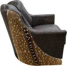 Load image into Gallery viewer, Brown leather swivel chair with quilted diamond tufted pattern and authentic axis deer hide wrapped around the outside arms