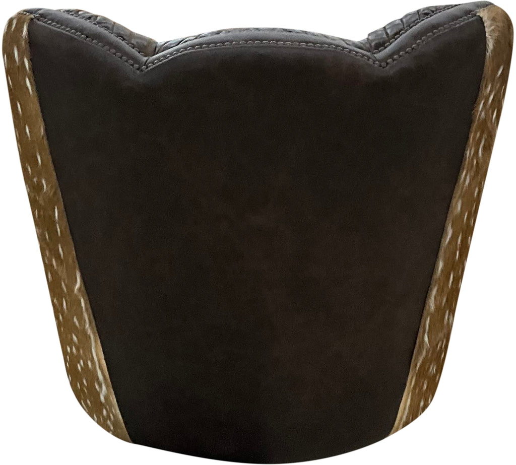 Brown leather swivel chair with quilted diamond tufted pattern and authentic axis deer hide wrapped around the outside arms