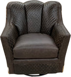 Brown leather swivel chair with quilted diamond tufted pattern and authentic axis deer hide wrapped around the outside arms