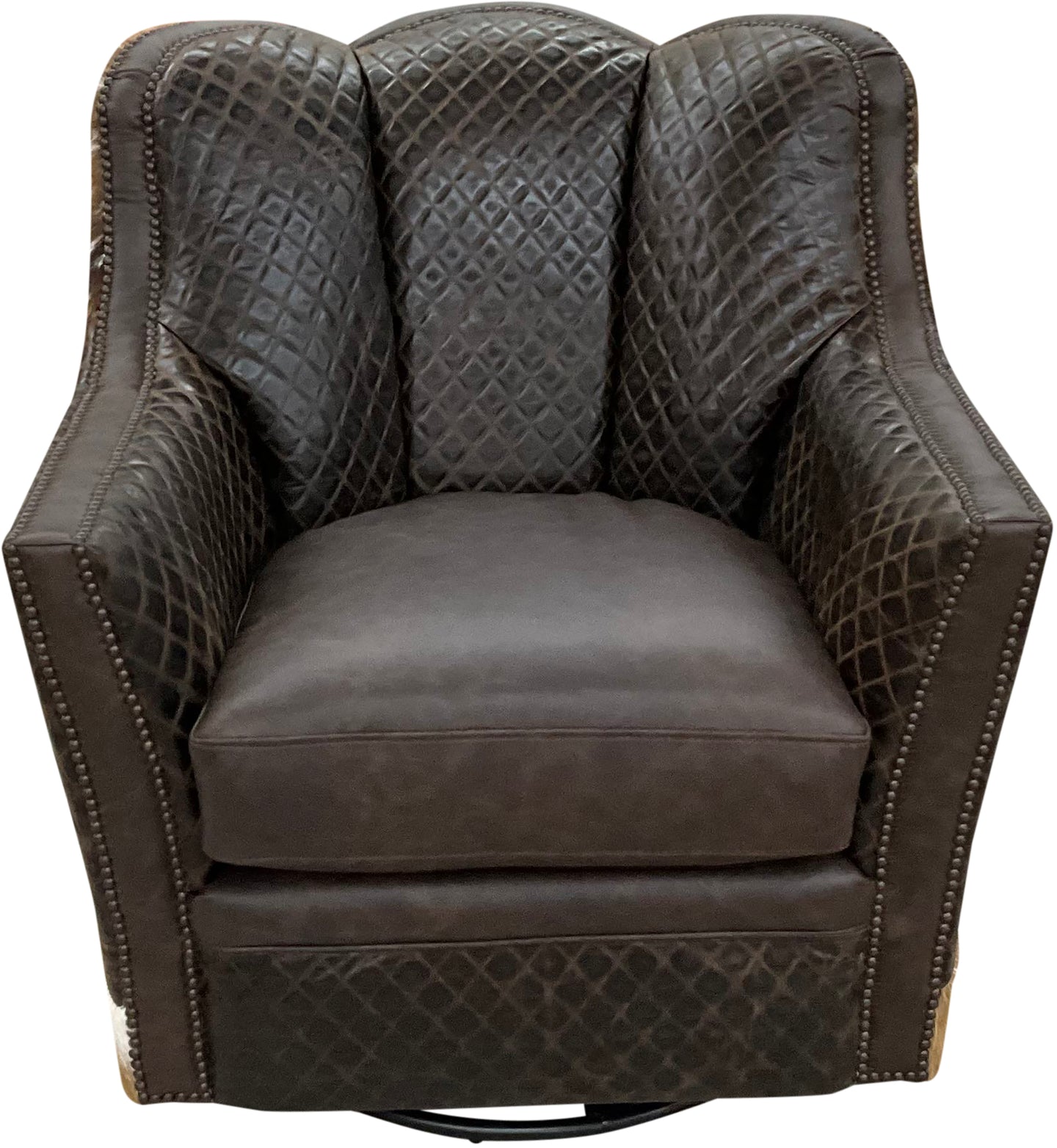 Brown leather swivel chair with quilted diamond tufted pattern and authentic axis deer hide wrapped around the outside arms