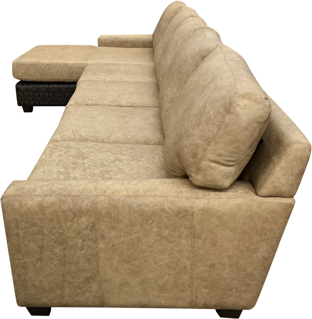 The Landman Sectional features Landman Oatmeal leather with Lindt Mocha accents, offering a spacious layout with a chaise and versatile seating. Stylish, durable, and perfect for modern or Western-inspired interiors.
