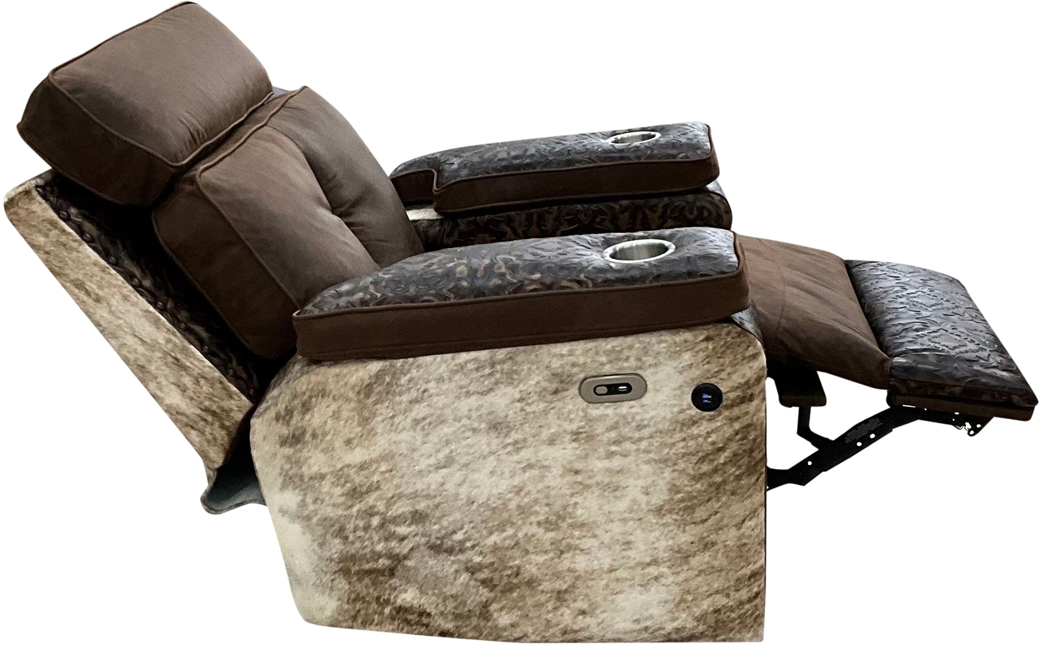 Relax in Western style with the Dakota Rocker Recliner, crafted in Cora Pecan leather, Del Rio Brown accents, and light exotic brindle hide. Features oversized metal cup holders built to fit YETI tumblers.