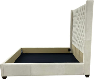 Madison Tufted Bed with wingback headboard in cream Satin Suede leather. Modern silhouette, traditional tufting—custom sizes available.