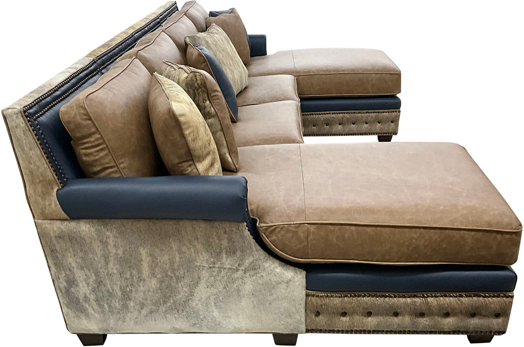 The High Plains Sectional features Palio Camel leather, Palio Grey accent trim, and light exotic cowhide for a modern western luxury statement. Oversized comfort, deep chaise seating, hand applied nailheads, and fully customizable ranch estate craftsmanship.